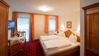 Posteľ alebo postele v izbe v ubytovaní Hotel Hammerwirt - Forellenhof