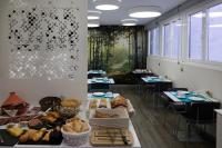 a room filled with tables with bread and pastries at Salamanca Suite Studios in Salamanca
