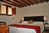 Postel nebo postele na pokoji v ubytování Hotel Rural El Mondalón