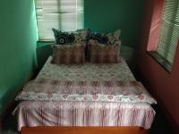 A bed or beds in a room at Hotel Bilyana