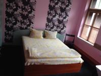 A bed or beds in a room at Hotel Bilyana