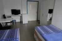 Telewizja i/lub zestaw kina domowego w obiekcie Montagehotel Bed & Steel