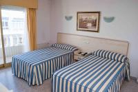 Postel nebo postele na pokoji v ubytování Hotel Mediterráneo