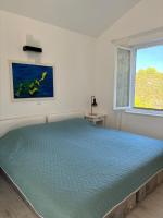 Posteľ alebo postele v izbe v ubytovaní Vidučić Apartments