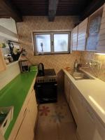 Kuchyň nebo kuchyňský kout v ubytování Holiday Home Ille