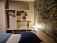 Posteľ alebo postele v izbe v ubytovaní Gîte et SPA Chez Jules