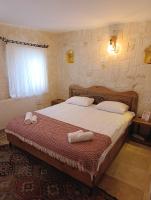 Postel nebo postele na pokoji v ubytování Asma Cave House
