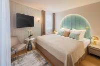 Łóżko lub łóżka w pokoju w obiekcie Lotus Therme Hotel & Spa