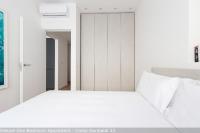 A bed or beds in a room at Brera Apartments in Garibaldi