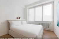 A bed or beds in a room at Brera Apartments in Garibaldi