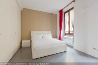 A bed or beds in a room at Brera Apartments in Garibaldi