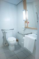 a bathroom with a toilet and a sink at ibis Itu Plaza Shopping in Itu