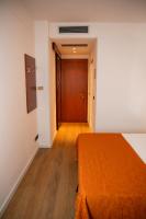 A bed or beds in a room at Hotel Sirena - B&B