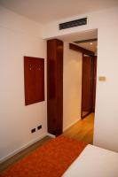 A bed or beds in a room at Hotel Sirena - B&B
