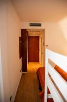 A bed or beds in a room at Hotel Sirena - B&B