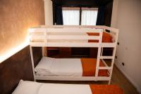 A bed or beds in a room at Hotel Sirena - B&B