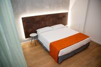 A bed or beds in a room at Hotel Sirena - B&B