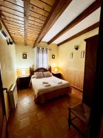 A bed or beds in a room at Casas Rurales Carrizosa