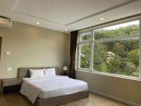 Ein Bett oder Betten in einem Zimmer der Unterkunft Lan Anh Villas Resort