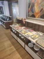 een buffet met eten in een winkel bij Rila Residence - next to Pirin Golf in Razlog