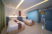 Blue Carina Hotel Phuketにあるベッド