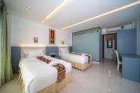 Blue Carina Hotel Phuketにあるベッド