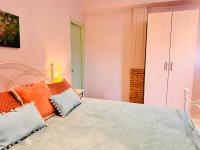 Postel nebo postele na pokoji v ubytování Dolce Vita Apartments - Spacious Renovated Apartments with Unique Decor Perfect for 4 in Laganas Ideal for Fun and Relaxation By Villa Mana Gers