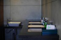 a bathroom with a sink and a counter with towels at The Clouds End in Devikolam