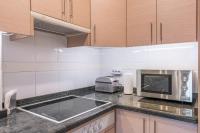 Kuchyň nebo kuchyňský kout v ubytování Apartamento Aravirma