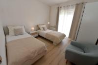 Posteľ alebo postele v izbe v ubytovaní Apartments Olive Garden