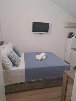 Posteľ alebo postele v izbe v ubytovaní Apartments Olive Garden