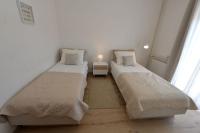 Posteľ alebo postele v izbe v ubytovaní Apartments Olive Garden