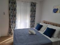 Posteľ alebo postele v izbe v ubytovaní Apartments Olive Garden