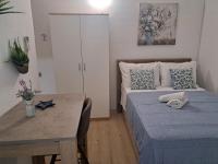 Posteľ alebo postele v izbe v ubytovaní Apartments Olive Garden