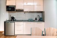 Kuchyňa alebo kuchynka v ubytovaní Apartamenty Majer Łeba