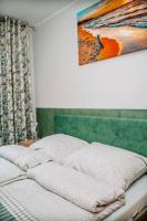 Posteľ alebo postele v izbe v ubytovaní Apartamenty Majer Łeba