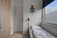 Postel nebo postele na pokoji v ubytování Vakantiehuis Beau - Julianadorp aan Zee