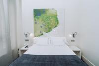 Postel nebo postele na pokoji v ubytování Hostal Acuarela