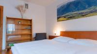 Postel nebo postele na pokoji v ubytování Holiday House Mária