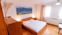 Postel nebo postele na pokoji v ubytování Holiday House Mária