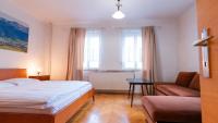 Postel nebo postele na pokoji v ubytování Holiday House Mária