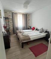 Łóżko lub łóżka w pokoju w obiekcie Piknik Apartmant