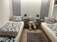 Łóżko lub łóżka w pokoju w obiekcie Piknik Apartmant