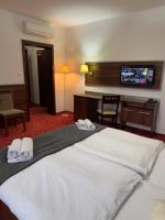 Posteľ alebo postele v izbe v ubytovaní Hotel Barbakan