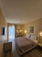 Posteľ alebo postele v izbe v ubytovaní Hotel London