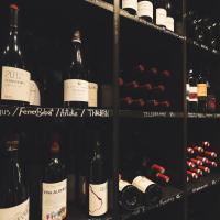 a bunch of bottles of wine in a cellar at Manoir du Vignoble in Vionnaz