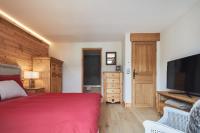 Łóżko lub łóżka w pokoju w obiekcie Luxueux chalet avec terrasse Auron