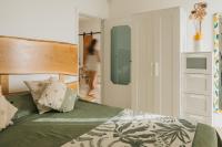 A bed or beds in a room at Casa Tua - Sea View Onda