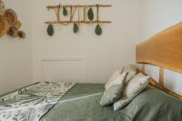 A bed or beds in a room at Casa Tua - Sea View Onda