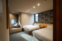TRIGON Hotel FUKUOKAにあるベッド